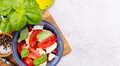 Caprese salad with ripe tomatoes, mozzarella cheese and garden basil - PhotoDune Item for Sale