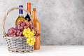 Ripe grape in basket and wine bottles - PhotoDune Item for Sale