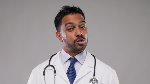 Indian Male Doctor Having Video Conference Call 13