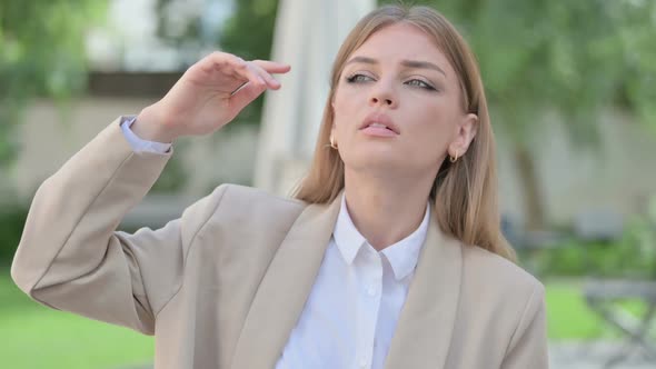 Outdoor Portrait of Young Businesswoman Looking Around Searching