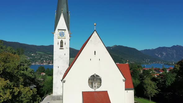 Aerial of lake Tegernsee and Maria Himmelfahrt parish church