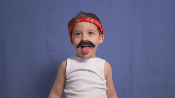 Funny Mexican Boy with a Big Black Mustache and a White t Shirt