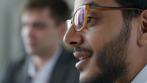 Diverse Businessmen Listening to Colleagues on Office Meeting