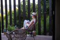 Young beautiful woman relaxing on cozy terrace, reading a book, digital detox and weekend away - PhotoDune Item for Sale