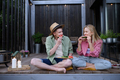 Cheerful young couple in love eating slice of watermelon together - PhotoDune Item for Sale