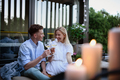 Young couple clinking with wine outdoors, weekend away in tiny house in countryside, sustainable - PhotoDune Item for Sale