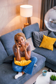 Woman having phone conversation while relaxing at home - PhotoDune Item for Sale
