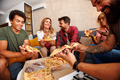 People eating pizza while spending leisure time at home - PhotoDune Item for Sale