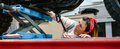 Mechanic woman checking motorcycle over platform - PhotoDune Item for Sale