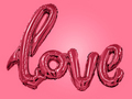 inflatable letters love toned in color of 2023 viva magenta. balloon lettering love colored in viva  - PhotoDune Item for Sale