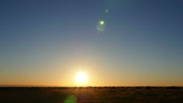 Bright Sun Over Field Wide Time-lapse