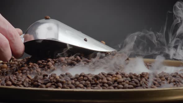 Roasted Coffee Seeds Scooping Using Ladle Closeup