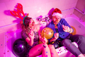 Couple holding balloons shaped as numbers 2023 at New Year party - PhotoDune Item for Sale