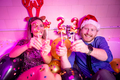 Couple having fun celebrating New Year at house party - PhotoDune Item for Sale