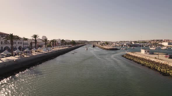 Fly over Bensafrim river and Marina de Lagos, Algarve, Portugal. Yachts moored