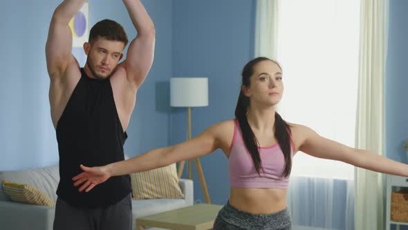 Man and Woman Get Ready To Practice Morning Yoga