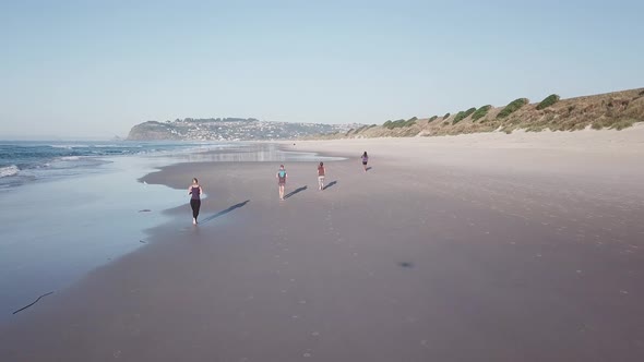 People running on the beach