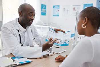 clinic and explaining medical benefits to a woman.