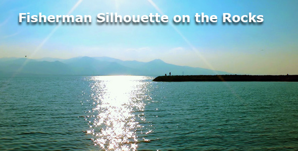 Fisherman Silhouette On The Rocks And The Sea alt