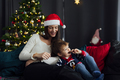 Woman with her son celebrating christmas at home - PhotoDune Item for Sale