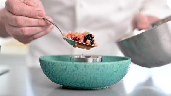 A Chef Prepares Delicious Vegetables and Fruits Tartare and Finishes the Preparation with a Touch of
