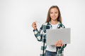Caucasian smart teenage preteen schoolgirl using credit card and laptop - PhotoDune Item for Sale