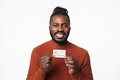 Happy young african-american man customer client holding credit card - PhotoDune Item for Sale