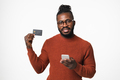 E-banking, e-commerce concept. African-american young man using cellphone - PhotoDune Item for Sale