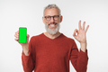 Smiling happy caucasian mature middle-aged man holding cellphone  - PhotoDune Item for Sale