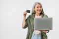 Mature middle-aged caucasian woman grandmother using credit card  - PhotoDune Item for Sale
