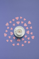 White cup with small red heart-shaped candy on the bottom. - PhotoDune Item for Sale