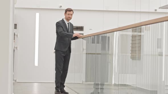 Portrait of Elegant Businessman in Suit Indoors