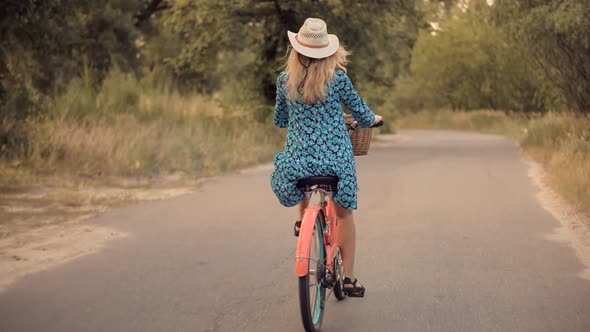 Cyclist Girl Wearing Dress Workout. Hair Blowing When Cycling. .Hair Blowing On Cycling.