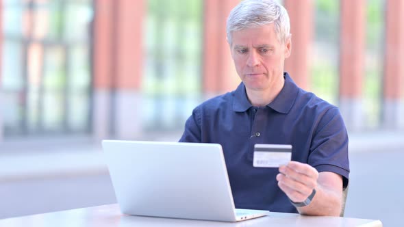 Outdoor Online Payment Problem for Upset Middle Aged Businessman