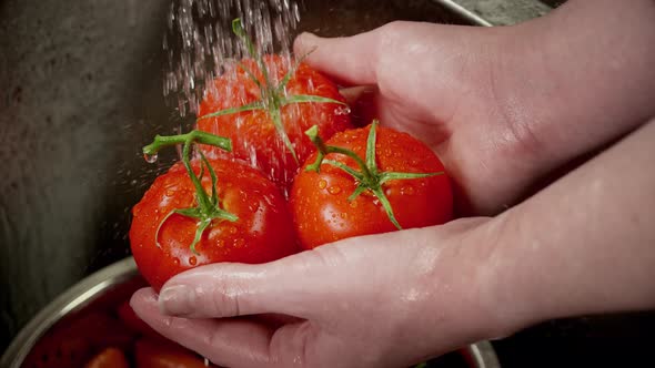 Close Up Of Tomatoes Being Washed