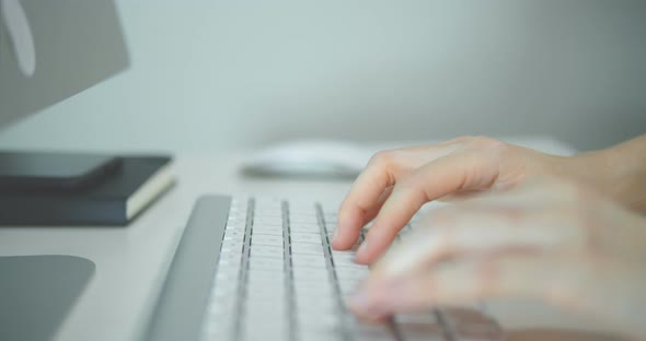 Hands Typing On Computer