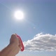 Close up of hand playing and holding a flying kite in the sky - VideoHive Item for Sale