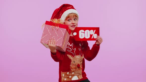 Child Girl in Christmas Hat Showing Gift Boxes and 60 Percent Discount Inscriptions Banner Text Note