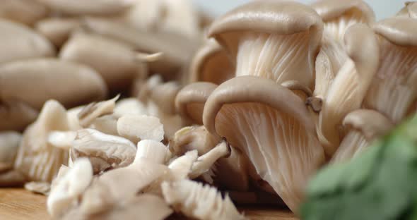 The Mushroom Pieces Fall To the Cutting Board