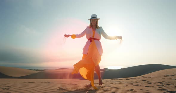 Attractive Girl Taking Sand in Hands