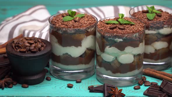 Classic Tiramisu Dessert in a Glass on Blue Wooden Background