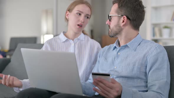 Young Couple Having Online Payment Loss on Laptop at Home