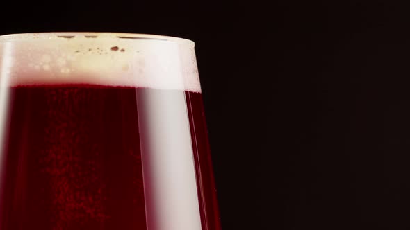 Foamy Cherry Beer in Glass Closeup Belgian Lambic