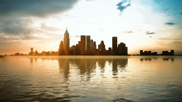 Skyline with Skyscrapers and Sea at Sunset