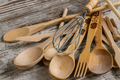 Many rustic wooden kitchen utensils close up. - PhotoDune Item for Sale