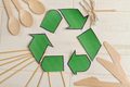 Top view recyclig symbol and wooden utensils. - PhotoDune Item for Sale