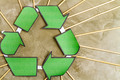 Close up green recycle sign and many wooden sticks. - PhotoDune Item for Sale