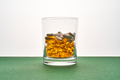 A glass with vitamins and other medical preparations. - PhotoDune Item for Sale