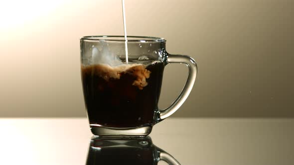 Milk poured into coffee in ultra slow motion 1500fps - COFFEE w MILK