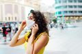  Young woman adjusting white face mask on her face outdoors. - PhotoDune Item for Sale